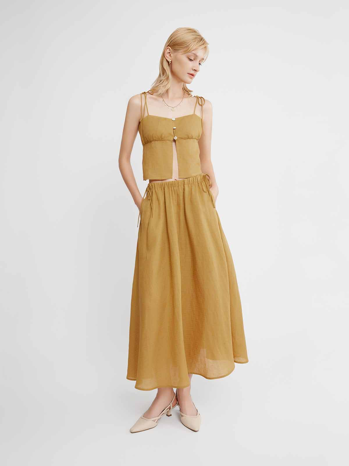 Woman wearing a mustard yellow dress Tie-Waist Lyocell-Linen Maxi Skirt